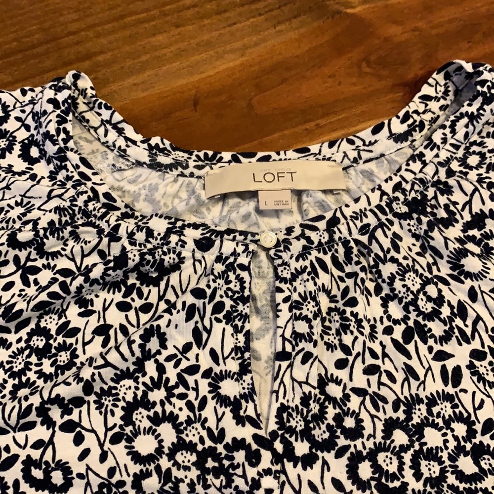 Loft short sleeve shirt. White with flowers. Keyhole closure on neck. Size Large